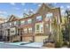 Beautiful brick townhomes with well-maintained landscaping, front garages, and inviting staircases at 2766 Birch Grove Se Ln # 11, Marietta, GA 30067