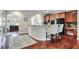Open concept kitchen with a breakfast bar, stainless steel appliances, and views into adjacent rooms at 2766 Birch Grove Se Ln # 11, Marietta, GA 30067