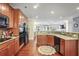Open kitchen with granite countertops, stainless steel appliances, and hardwood flooring throughout at 2766 Birch Grove Se Ln # 11, Marietta, GA 30067