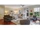 Bright living room with a large sectional sofa, ceiling fan, and access to the outdoor area at 2766 Birch Grove Se Ln # 11, Marietta, GA 30067
