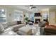 Cozy living room featuring a fireplace, comfortable seating, and a large window providing natural light at 2766 Birch Grove Se Ln # 11, Marietta, GA 30067