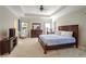 Spacious main bedroom featuring tray ceiling, plush carpet, and large window at 2766 Birch Grove Se Ln # 11, Marietta, GA 30067