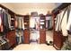 Spacious walk-in closet with custom shelving and hanging racks for organized storage at 2766 Birch Grove Se Ln # 11, Marietta, GA 30067