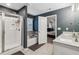 Well-appointed bathroom with a separate shower, soaking tub, and double sink vanity at 4443 Quilter St, Powder Springs, GA 30127