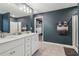 Stylish bathroom with double sinks, a walk-in shower, and modern fixtures at 4443 Quilter St, Powder Springs, GA 30127