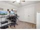 Neutral bedroom featuring a closet, ceiling fan, and mounted monitor at 4443 Quilter St, Powder Springs, GA 30127