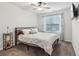 Bedroom with a ceiling fan, tv and metal bed frame at 4443 Quilter St, Powder Springs, GA 30127