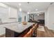 Spacious kitchen island with seating overlooks the dining and living areas at 4443 Quilter St, Powder Springs, GA 30127