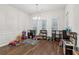 Spacious sitting room filled with toys, featuring hardwood floors and ample natural light at 4443 Quilter St, Powder Springs, GA 30127