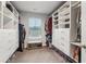Organized walk-in closet featuring custom shelving, drawers, and ample storage space at 4443 Quilter St, Powder Springs, GA 30127