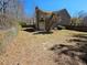 Spacious backyard with mature trees, and fencing at 100 Iverson Pl, Temple, GA 30179