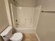 Cozy bathroom featuring a shower-tub combination and neutral color palette at 100 Iverson Pl, Temple, GA 30179