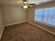 Bedroom with neutral carpeting, a ceiling fan, and a window with blinds at 100 Iverson Pl, Temple, GA 30179