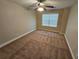 Bedroom with neutral carpeting, a ceiling fan, and a window with blinds at 100 Iverson Pl, Temple, GA 30179