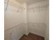 Spacious walk-in closet with carpet and open shelving, great for organizing at 100 Iverson Pl, Temple, GA 30179