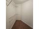 Carpeted walk-in closet featuring white wire shelving for organized storage solutions at 100 Iverson Pl, Temple, GA 30179
