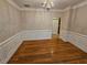 Dining room with hardwood floors, decorative trim and chandelier at 100 Iverson Pl, Temple, GA 30179