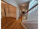 Inviting foyer featuring gleaming hardwood floors and staircase with natural sunlight at 100 Iverson Pl, Temple, GA 30179