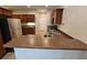 Kitchen area with stainless steel refrigerator and bar-style counter at 100 Iverson Pl, Temple, GA 30179