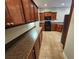 Kitchen with ample counter space and dark wood cabinetry at 100 Iverson Pl, Temple, GA 30179