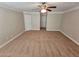Large main bedroom with a ceiling fan and multiple doorways at 100 Iverson Pl, Temple, GA 30179