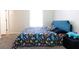 Comfortable bedroom offers a dinosaur-themed bed and ample natural light from the window at 33 Timber Ridge Dr, Cartersville, GA 30121