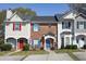 Charming townhouses featuring colorful doors, shutters, and inviting landscaping at 33 Timber Ridge Dr, Cartersville, GA 30121