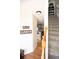 Hallway with hardwood floors, white walls and a staircase to the upper level at 33 Timber Ridge Dr, Cartersville, GA 30121