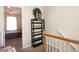 Second-story hallway with a black bookshelf and a view into a bedroom at 33 Timber Ridge Dr, Cartersville, GA 30121