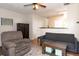 Well-lit living room features a plush sofa, hardwood floors, and an area rug at 33 Timber Ridge Dr, Cartersville, GA 30121