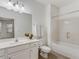 Clean bathroom with white vanity, toilet and bathtub and shower combo at 1045 Brook Knoll Ln # 401, Cumming, GA 30041