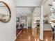 Open-concept living space with hardwood floors, fireplace, and seamless flow into kitchen at 1045 Brook Knoll Ln # 401, Cumming, GA 30041