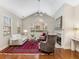 Inviting living room with vaulted ceiling, fireplace, large windows, and stylish decor at 1045 Brook Knoll Ln # 401, Cumming, GA 30041