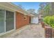 View of the back patio with brick retaining wall at 1933 Silvastone Dr, Decatur, GA 30033
