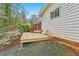 Backyard with deck, landscaping, and white siding at 1933 Silvastone Dr, Decatur, GA 30033