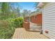Backyard deck with lush plants and a brick facade at 1933 Silvastone Dr, Decatur, GA 30033
