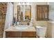 Bathroom featuring a granite vanity, matching cabinets and a tiled walk-in shower with mosaic details at 1933 Silvastone Dr, Decatur, GA 30033
