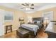 Cozy bedroom with dark wood furniture, hardwood floors and natural light coming through the windows at 1933 Silvastone Dr, Decatur, GA 30033
