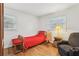 Bedroom with hardwood floors, windows and comfortable chair at 1933 Silvastone Dr, Decatur, GA 30033