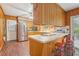 Eat-in kitchen bar area with vintage cabinets and stainless steel appliances at 1933 Silvastone Dr, Decatur, GA 30033