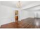 Elegant dining area showcasing a chandelier and hardwood floors, open to the kitchen at 1933 Silvastone Dr, Decatur, GA 30033