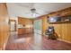 Cozy living space with wood paneling, a ceiling fan, and sliding glass doors at 1933 Silvastone Dr, Decatur, GA 30033