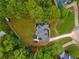 Overhead view of a private residence with a manicured lawn and a circular driveway in a wooded neighborhood at 3545 Silver Vista Ct, Cumming, GA 30041
