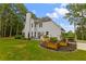 The backyard boasts a patio, outdoor kitchen, and beautifully landscaped garden beds, ideal for outdoor entertaining at 3545 Silver Vista Ct, Cumming, GA 30041