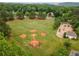 Aerial view of a baseball field, playground and community center in a beautiful, wooded setting at 3545 Silver Vista Ct, Cumming, GA 30041