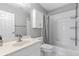 Clean and bright bathroom features a shower-tub combo and a vanity with storage at 3545 Silver Vista Ct, Cumming, GA 30041