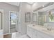 Bright bathroom featuring double sinks, a large mirror, a shower, a bath tub, and natural light at 3545 Silver Vista Ct, Cumming, GA 30041