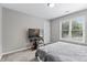 Cozy bedroom with neutral tones, a TV, and natural light from the window at 3545 Silver Vista Ct, Cumming, GA 30041