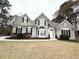 Elegant home with a symmetrical facade, manicured landscaping, and a welcoming front entrance at 3545 Silver Vista Ct, Cumming, GA 30041