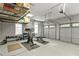 Spacious three car garage setup with a home gym at 3545 Silver Vista Ct, Cumming, GA 30041
